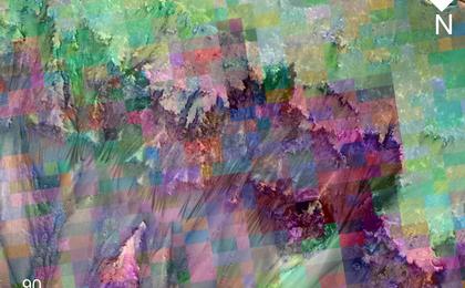 This image combines a photograph of seasonal dark flows on a Martian slope with a grid of colors based on data collected by a mineral-mapping spectrometer observing the same area.