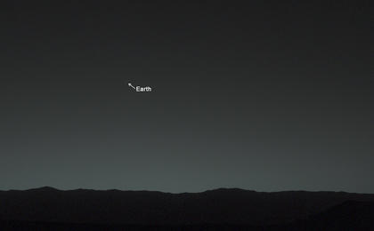 This view of the twilight sky and Martian horizon taken by NASA's Curiosity Mars rover includes Earth as the brightest point of light in the night sky.