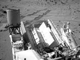 ASA's Curiosity Mars rover used the Navigation Camera (Navcam) on its mast to catch this look-back eastward at wheel tracks from driving through and past "Dingo Gap" inside Gale Crater.