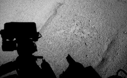 NASA's Curiosity Mars rover caught its own shadow in this image taken just after completing a drive of 329 feet (100.3 meters) on the 547th Martian day, or sol, of the rover's work on Mars (Feb. 18, 2014).