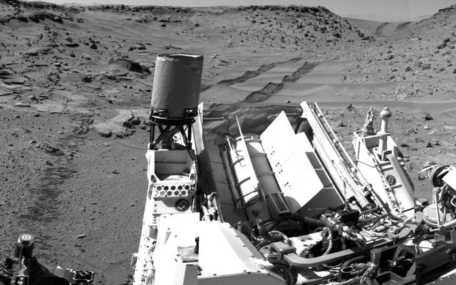 This panorama combining images taken on Feb. 10, 2014, by the Navigation Camera (Navcam) on NASA's Curiosity Mars rover looks back to where the rover crossed a dune at "Dingo Gap" four days earlier. The view is centered toward the east and spans about 225 degrees.
