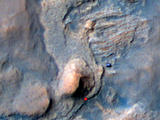 In this Mars Reconnaissance Orbiter view of the Curiosity rover mission's waypoint called "the Kimberley," the red dot indicates the location of a sandstone target, "Windjana," selected for close-up inspection. The