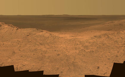 This scene from the panoramic camera (Pancam) on NASA's Mars Exploration Rover Opportunity catches "Pillinger Point," on the western rim of Endeavour Crater, in the foreground. The eastern rim of the crater is on the distant horizon. The scene merges many Pancam exposures taken on May 14, 2014.