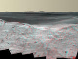 This stereo vista from the panoramic camera (Pancam) on NASA's Mars Exploration Rover Opportunity catches "Pillinger Point," on the western rim of Endeavour Crater, in the foreground. The May 14, 2014, image appears three-dimensional when seen through blue-red glasses with the red lens on the left.