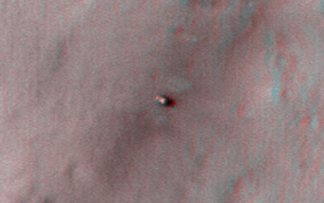 This 3D, or stereo anaglyph, view shows NASA's Mars rover Curiosity where it landed on Mars within Gale Crater, at a site now called Bradbury Landing.