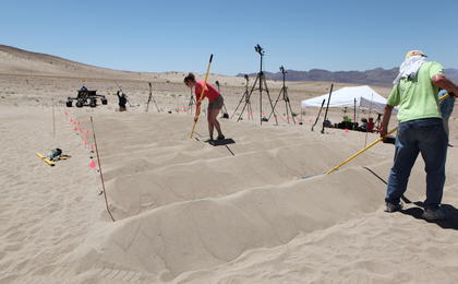 sand dune, mars rover, wheel, Dumont, Scarecrow, test - This image shows a row of uphill, white sand dunes that JPL engineers shape with long rakes for desert rover test, under blue skies.  The Scarecrow rover sits at the bottom, waiting to be tested.