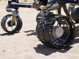 wheel, test, Scarecrow, Mars rover Rover wheels on Scarecrow with chevron-shaped treads rest on sand in Dumont dunes.