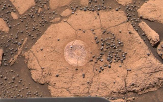 This image from the Mars Exploration Rover Opportunity's panoramic camera is an approximate true-color rendering of the exceptional rock called "Berry Bowl" in the "Eagle Crater" outcrop.