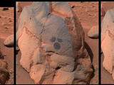 This image shows the rock dubbed "Humphrey" and the circular areas on the rock that were wiped off by the rover.