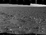 This image highlights the bumpy terrain surrounding the rover.