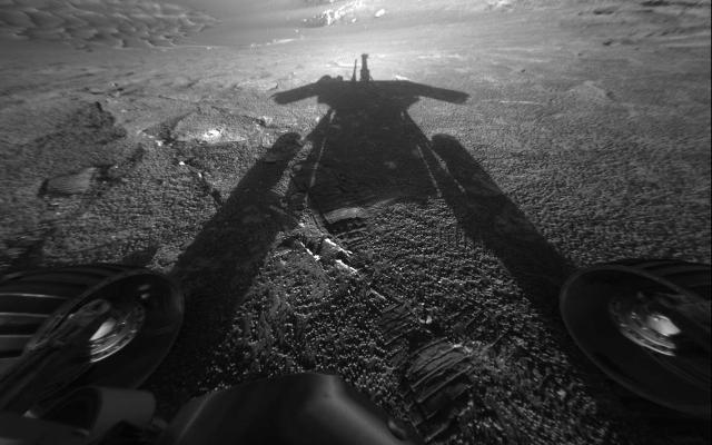 This self-portrait of NASA's Mars Exploration Rover Opportunity comes courtesy of the Sun and the rover's front hazard-avoidance camera.