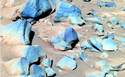 This false-color image taken by Spirit shows a group of darker rocks dubbed "Toltecs," lying to the southeast of the rover's position.