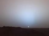 On May 19th, 2005, NASA's Mars Exploration Rover Spirit captured this stunning view as the Sun sank below the rim of Gusev crater on Mars.