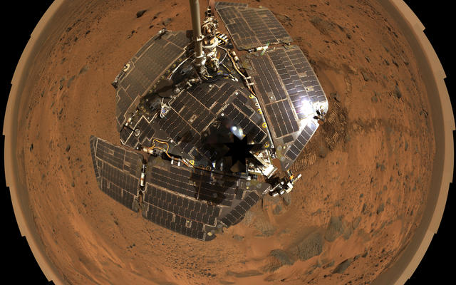 This bird's-eye view combines a self-portrait of the spacecraft deck and a panoramic mosaic of the Martian surface as viewed by the Spirit rover.