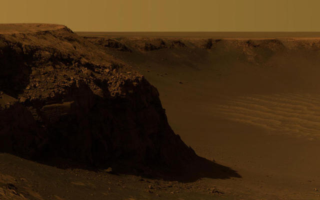 Opportunity captured this vista of "Victoria Crater" from the viewpoint of "Cape Verde," one of the promontories that are part of the scalloped rim of the crater.