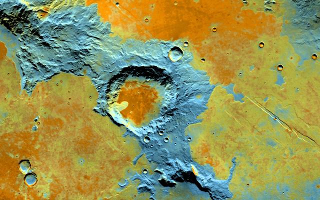 On the southwest edge of the immense volcanic region of Tharsis, lava from its giant volcanoes flowed down to meet the old cratered landscape of Terra Sirenum.