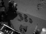 NASA's Mars rover Curiosity used a mechanism on its robotic arm to dig up five scoopfuls of material from a patch of dusty sand called "Rocknest," producing the five bite-mark pits visible in this image from the rover's left Navigation Camera (Navcam).