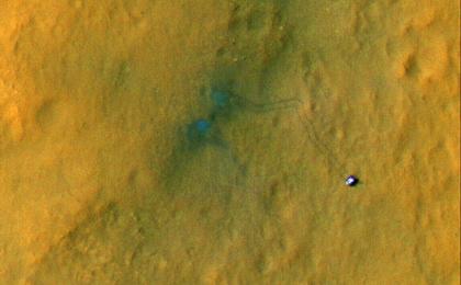 Tracks from the first drives of NASA's Curiosity rover are visible in this image captured by the High-Resolution Imaging Science Experiment (HiRISE) camera on NASA's Mars Reconnaissance Orbiter.