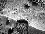 NASA's Mars rover Curiosity cut a wheel scuff mark into a wind-formed ripple at the "Rocknest" site to give researchers a better opportunity to examine the particle-size distribution of the material forming the ripple.