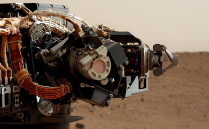 The left eye of the Mast Camera (Mastcam) on NASA's Mars rover Curiosity took this image of the camera on the rover's arm, the Mars Hand Lens Imager (MAHLI), during the 30th Martian day, or sol, of the rover's mission on Mars (Sept. 5, 2012).