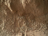 This image shows the wall of a scuffmark NASA's Curiosity made in a windblown ripple of Martian sand with its wheel.