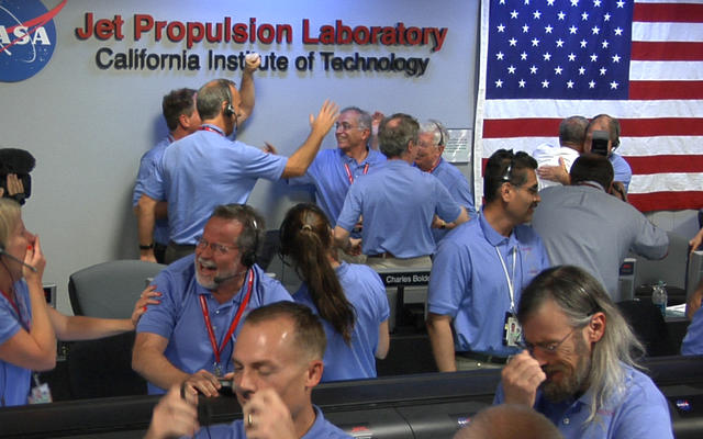 Engineers at NASA's Jet Propulsion Laboratory in Pasadena, Calif., celebrate the landing of NASA's Curiosity rover on the Red Planet. The rover touched down on Mars the evening of Aug. 5 PDT (morning of Aug. 6 EDT).