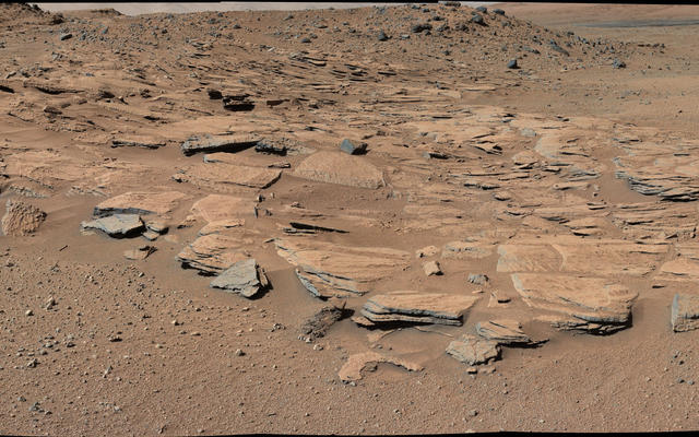 This image from Curiosity's Mastcam shows inclined beds of sandstone interpreted as the deposits of small deltas fed by rivers flowing down from the Gale Crater rim and building out into a lake where Mount Sharp is now.  It was taken March 13, 2014, just north of the "Kimberley" waypoint.