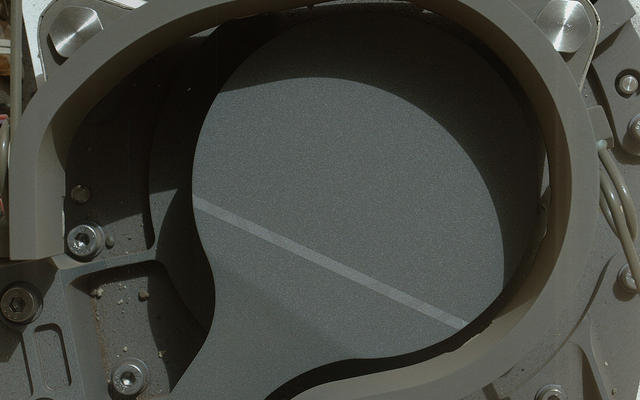This image from NASA's Curiosity rover shows the cover on an inlet that will receive powdered rock and soil samples for analysis.