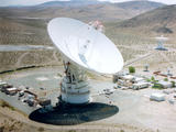 The 70m antenna at Goldstone, California against the background of the Mojave desert.