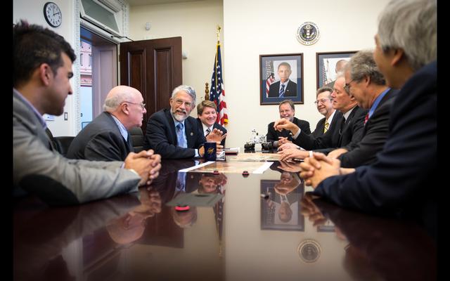 Dr. John Holdren, Director of the Office of Science and Technology Policy, 3rd from left, meets with members of the NASA Mars Science Laboratory team on Thursday, Aug. 1, 2013, at the Eisenhower Executive Office Building in Washington.