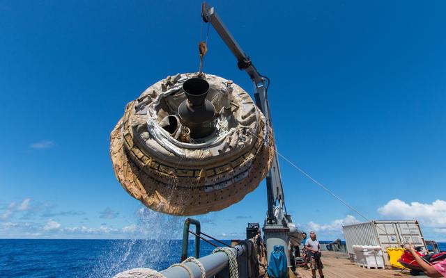 Hours after the June 28, 2014, test of NASA's Low-Density Supersonic Decelerator over the U.S. Navy's Pacific Missile Range, the saucer-shaped test vehicle is lifted aboard the Kahana recovery vessel.