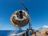 Hours after the June 28, 2014, test of NASA's Low-Density Supersonic Decelerator over the U.S. Navy's Pacific Missile Range, the saucer-shaped test vehicle is lifted aboard the Kahana recovery vessel.