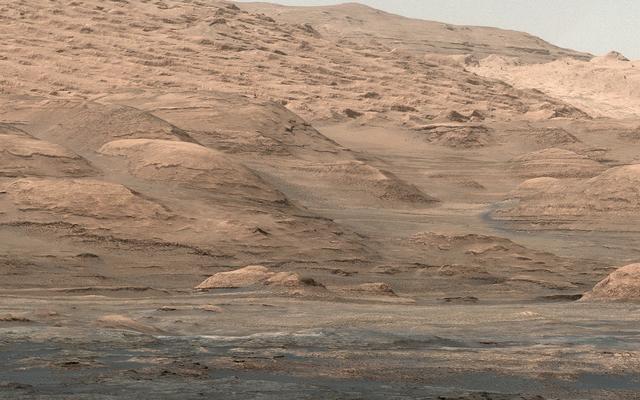 This view from the Mastcam on NASA's Curiosity Mars rover shows dramatic buttes and layers on the lower flank of Mount Sharp. It was taken on Sept. 7, 2013, from near the waypoint called "Darwin" on the route toward an entry point to the mountain.
