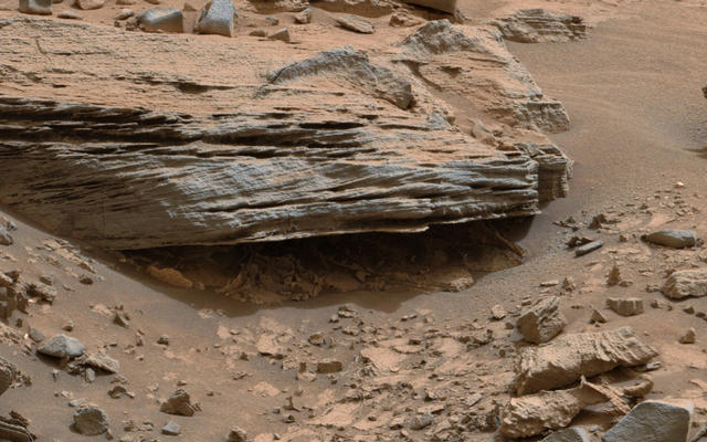 Cross-bedding seen in the layers of this Martian rock is evidence of movement of water recorded by the waves or ripples of loose sediment the water passed over, such as a current in a lake. This image was acquired by the Mastcam on NASA's Curiosity Mars rover on Nov. 2, 2014.