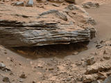 Cross-bedding seen in the layers of this Martian rock is evidence of movement of water recorded by the waves or ripples of loose sediment the water passed over, such as a current in a lake. This image was acquired by the Mastcam on NASA's Curiosity Mars rover on Nov. 2, 2014.