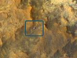 A view from NASA's Mars Reconnaissance Orbiter on April 8, 2015, catches sight of NASA's Curiosity Mars rover passing through a valley called "Artist's Drive" on the lower slope of Mount Sharp.