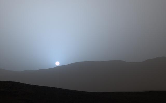NASA's Curiosity Mars rover recorded this view of the sun setting at the close of the mission's 956th Martian day, or sol (April 15, 2015), from the rover's location in Gale Crater.