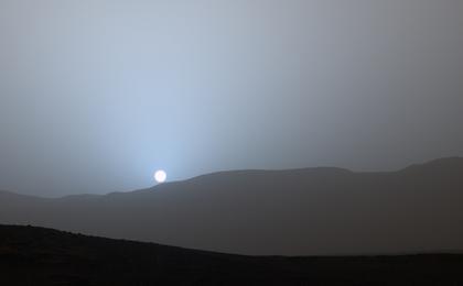 NASA's Curiosity Mars rover recorded this view of the sun setting at the close of the mission's 956th Martian day, or sol (April 15, 2015), from the rover's location in Gale Crater.