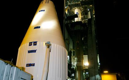 A transporter moves NASA's MAVEN spacecraft, inside a payload fairing, to the Vertical Integration Facility at Launch Complex 41 where it will be hoisted atop a United Launch Alliance Atlas V rocket that will boost it into space and on to Mars.