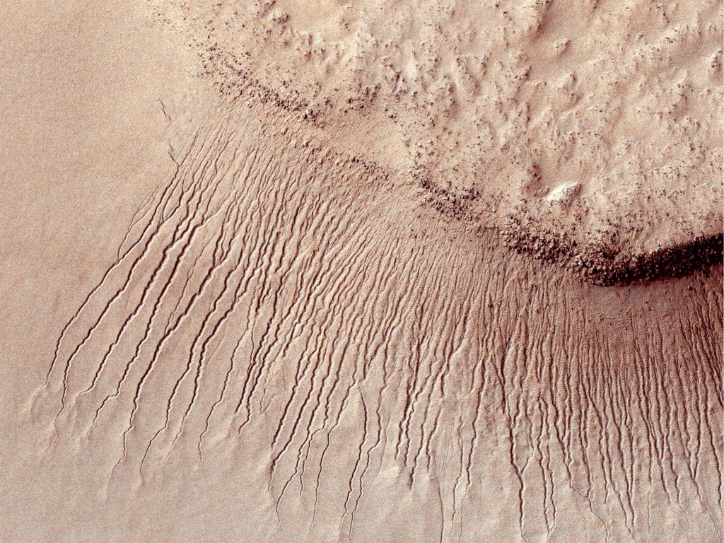 Images like this from the High Resolution Imaging Science Experiment (HiRISE) camera on NASA's Mars Reconnaissance Orbiter show portions of the Martian surface in unprecedented detail. 