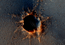 read the news article 'Color View from Orbit Shows Mars Rover Beside Crater'