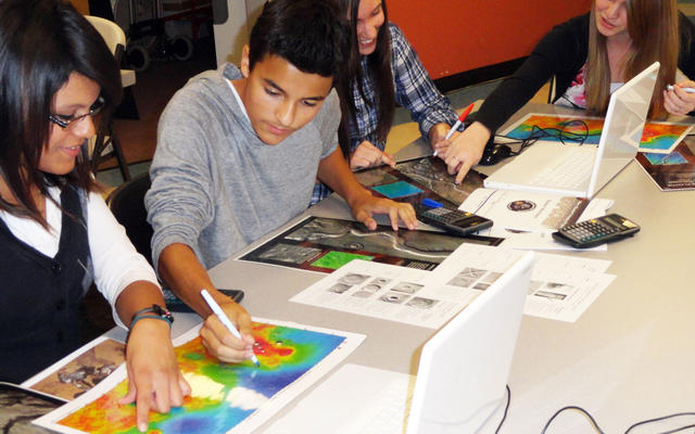 Ninth-grade, high-school students from Peoria, AZ analyze images of Mars.