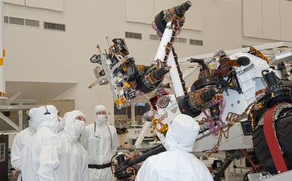Testing of the robotic arm on NASA's Mars rover Curiosity on Sept. 3, 2010, included movements of the arm while the rover was on a table tilted to 20 degrees to simulate a sloped surface on Mars.