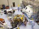 In the Payload Hazardous Servicing Facility at NASA's Kennedy Space Center in Florida, NASA's Mars Science Laboratory (MSL) rover, known as Curiosity, is being prepared to be moved to a rotation fixture for testing.
