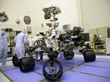Technicians at the Payload Hazardous Servicing Facility at NASA's Kennedy Space Center in Florida, put the instrument mast and science boom on NASA's Mars Science Laboratory (MSL) rover, known as Curiosity, through a series of deployment tests.