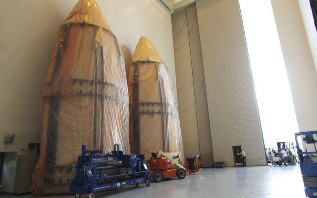 The dual sections of the Atlas V payload fairing for NASA's Mars Science Laboratory (MSL) mission await further processing in the airlock of the Payload Hazardous Servicing Facility at NASA's Kennedy Space Center in Florida.