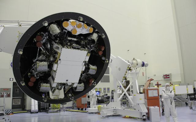 At the Payload Hazardous Servicing Facility at NASA's Kennedy Space Center in Florida, the "back shell powered descent vehicle" configuration of NASA's Mars Science Laboratory is being rotated for final closeout actions.