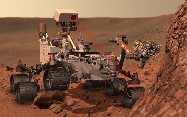 This artist's concept depicts the rover Curiosity, of NASA's Mars Science Laboratory mission, as it uses its Chemistry and Camera (ChemCam) instrument to investigate the composition of a rock surface.