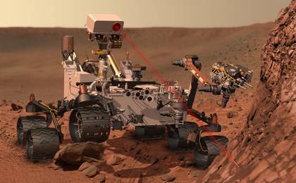 This artist's concept depicts the rover Curiosity, of NASA's Mars Science Laboratory mission, as it uses its Chemistry and Camera (ChemCam) instrument to investigate the composition of a rock surface.