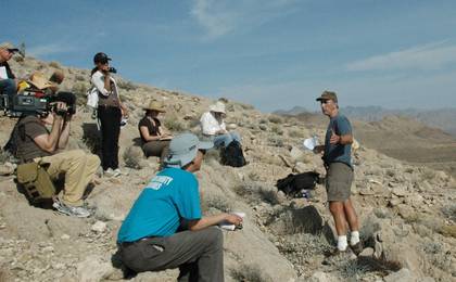 A group of journalists take part in a field trip to learn about the clues hidden in the rock layers with Curiosity Project Scientist, John Grotzinger.